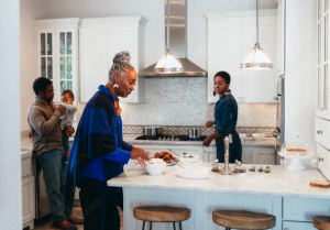 Multi-generational family cooking in new kitchen